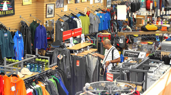 A shopper looking at hiking pants.